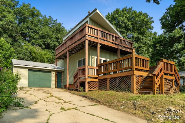 65 Sundago Park St, Hastings, MI 49058 - chalet / cabin with stairs, an outdoor structure, a deck, and driveway