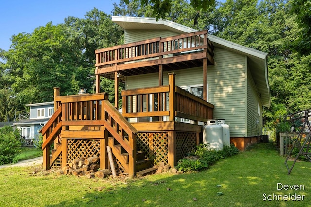 65 Sundago Park St, Hastings, MI 49058 - back of house with stairs, a yard, and a wooden deck