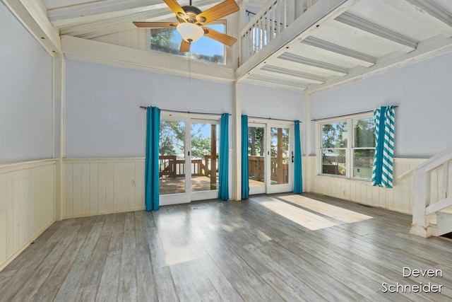 65 Sundago Park St, Hastings, MI 49058 - unfurnished room with french doors, a wainscoted wall, healthy amount of natural light, wood finished floors, and a ceiling fan