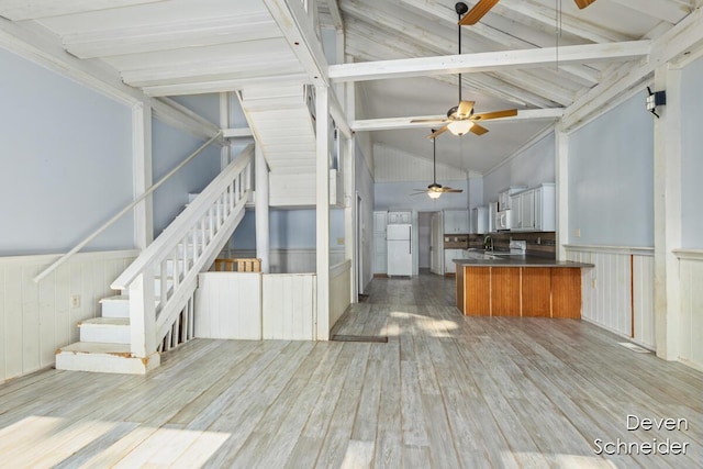 65 Sundago Park St, Hastings, MI 49058 - kitchen with white appliances, ceiling fan, open floor plan, light wood-style floors, and a peninsula
