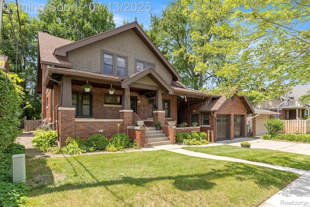 830 S Brady Rd, Dearborn, MI 48124 - view of front facade featuring brick siding, a porch, driveway, and a shingled roof