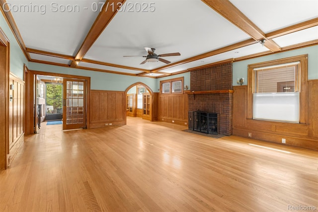 830 S Brady Rd, Dearborn, MI 48124 - unfurnished living room featuring coffered ceiling, a wainscoted wall, light wood-style floors, beam ceiling, and a ceiling fan