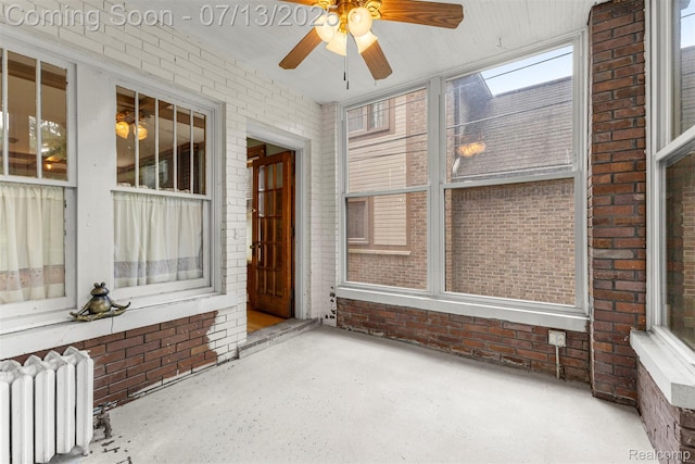 830 S Brady Rd, Dearborn, MI 48124 - unfurnished sunroom featuring radiator and a ceiling fan