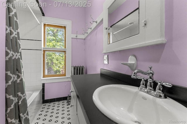 830 S Brady Rd, Dearborn, MI 48124 - full bathroom featuring radiator heating unit, shower / bath combo with shower curtain, and vanity