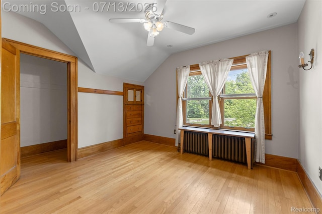 830 S Brady Rd, Dearborn, MI 48124 - additional living space with radiator, light wood finished floors, vaulted ceiling, and ceiling fan