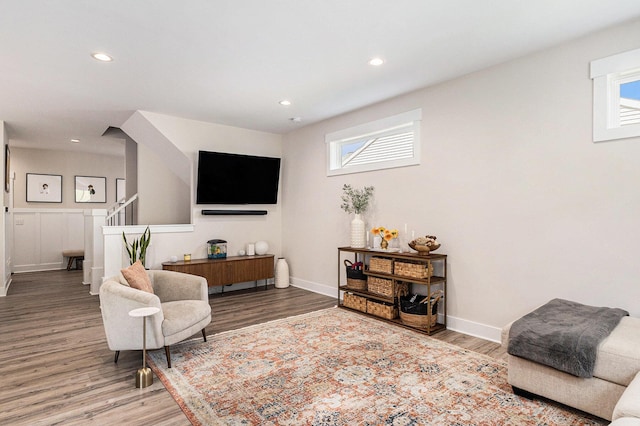 1014 Castlebay Way Unit 8, Hudsonville, MI 49426 - living area featuring wood finished floors, healthy amount of natural light, stairs, and recessed lighting
