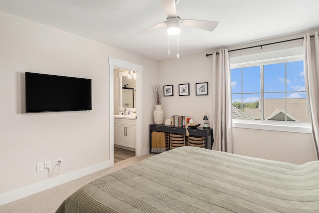 1014 Castlebay Way Unit 8, Hudsonville, MI 49426 - bedroom featuring light carpet, a ceiling fan, and connected bathroom