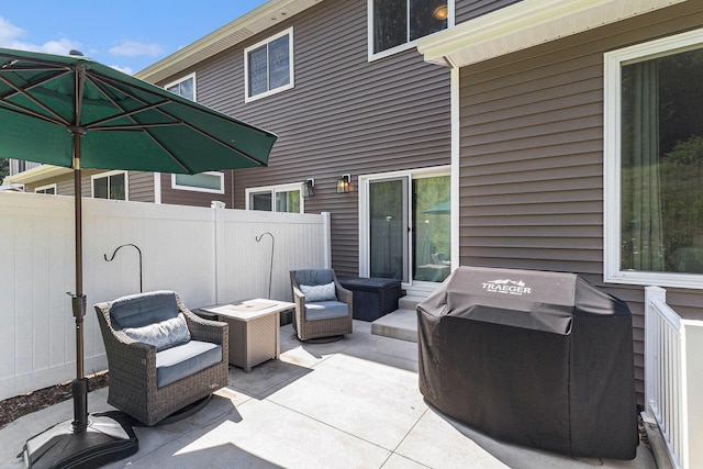 1014 Castlebay Way Unit 8, Hudsonville, MI 49426 - view of patio featuring an outdoor living space and a grill