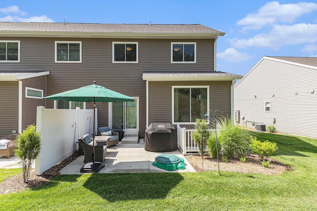 1014 Castlebay Way Unit 8, Hudsonville, MI 49426 - back of property with a patio area, outdoor lounge area, and a shingled roof