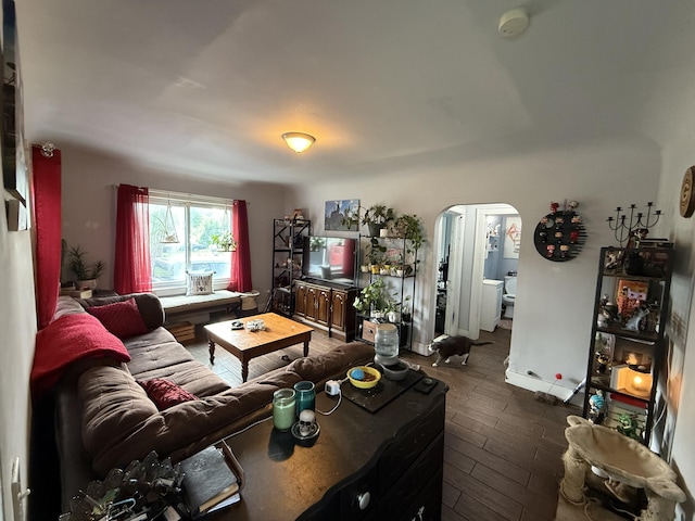 26 Edna Ave, Pontiac, MI 48341 - living area featuring arched walkways and dark wood-style flooring