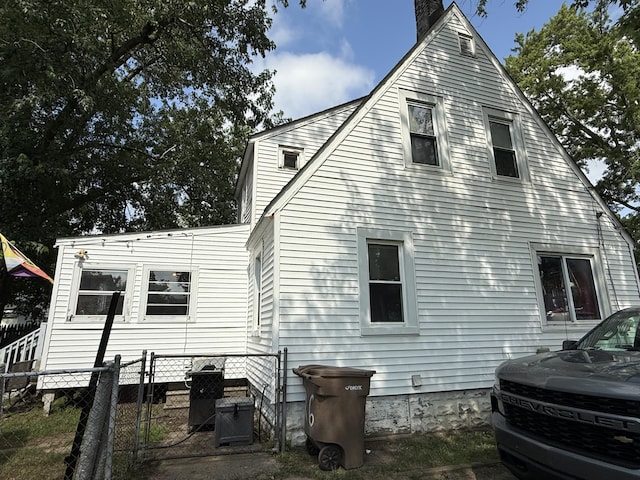 26 Edna Ave, Pontiac, MI 48341 - rear view of property featuring a chimney