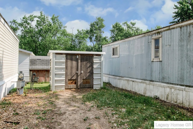 961 Dolphin St SW Unit 013, Wyoming, MI 49509 - view of yard with a storage shed