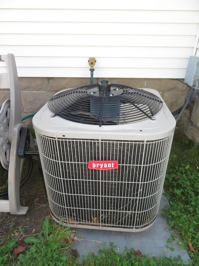 449 4th St, Manistee, MI 49660 - exterior view of a central AC unit