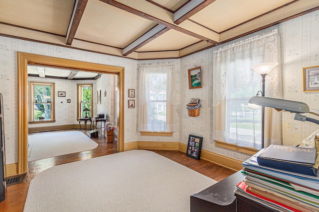 449 4th St, Manistee, MI 49660 - sitting room featuring wood finished floors, wallpapered walls, coffered ceiling, and beam ceiling