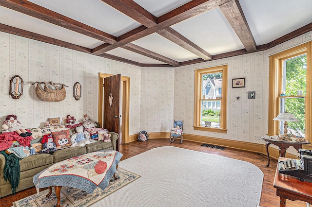 449 4th St, Manistee, MI 49660 - living room featuring healthy amount of natural light, wood finished floors, beam ceiling, and coffered ceiling