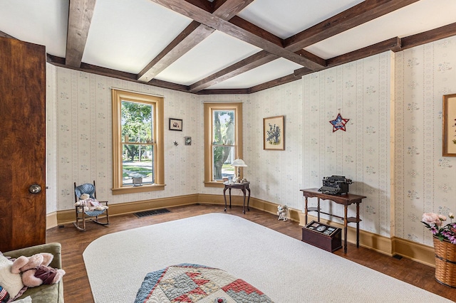 449 4th St, Manistee, MI 49660 - living area with wood finished floors and beamed ceiling