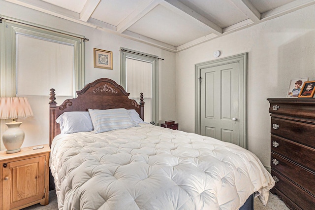 449 4th St, Manistee, MI 49660 - bedroom with beam ceiling, carpet, and coffered ceiling
