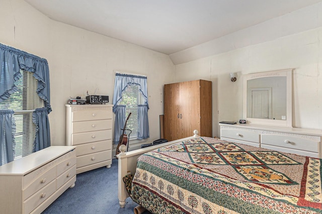 449 4th St, Manistee, MI 49660 - bedroom featuring dark carpet and lofted ceiling