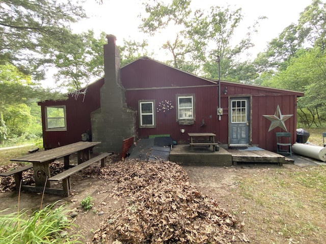 2031 E Oak St, Newaygo, MI 49337 - rear view of property with a chimney