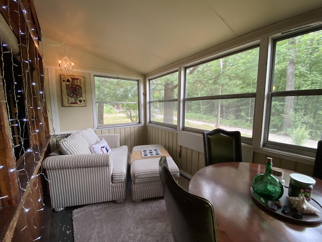 2031 E Oak St, Newaygo, MI 49337 - sunroom with lofted ceiling, plenty of natural light, and carpet floors