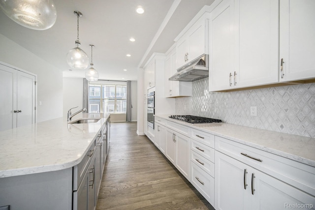 2965 Aughton Rd, Ann Arbor, MI 48105 - kitchen with under cabinet range hood, appliances with stainless steel finishes, gray cabinets, backsplash, and recessed lighting