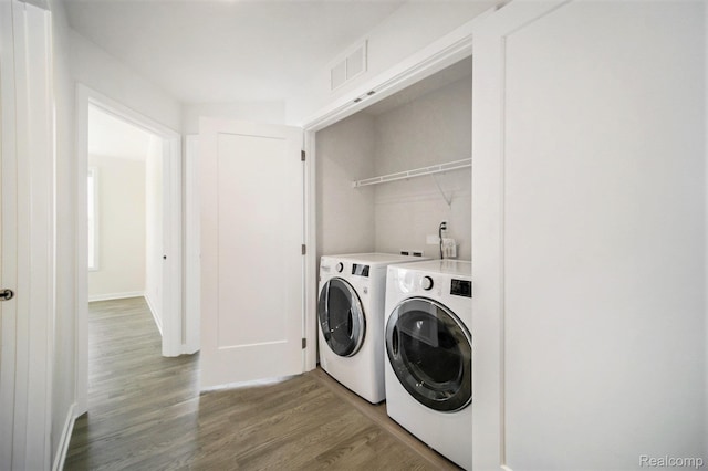 2965 Aughton Rd, Ann Arbor, MI 48105 - washroom with washer and clothes dryer and wood finished floors