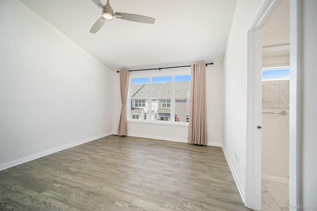 2965 Aughton Rd, Ann Arbor, MI 48105 - empty room with lofted ceiling, ceiling fan, and light wood-style flooring