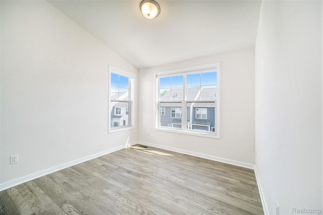 2965 Aughton Rd, Ann Arbor, MI 48105 - unfurnished room with lofted ceiling and wood finished floors
