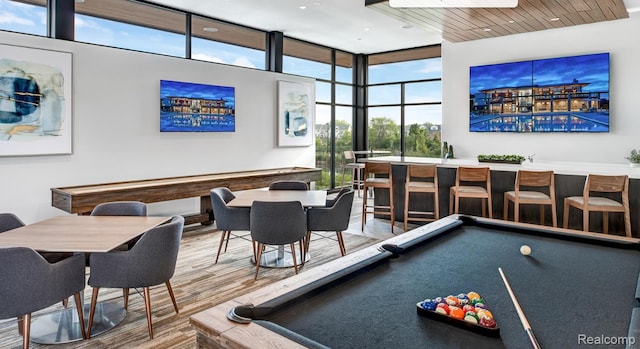 2965 Aughton Rd, Ann Arbor, MI 48105 - recreation room featuring pool table, wood finished floors, a wall of windows, and a community bar