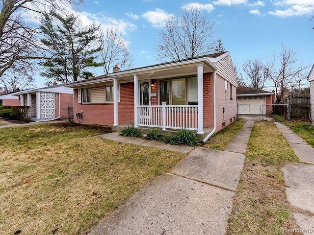 33855 Cherry Hill Rd, Westland, MI 48186 - view of front of home featuring brick siding, covered porch, a chimney, and driveway