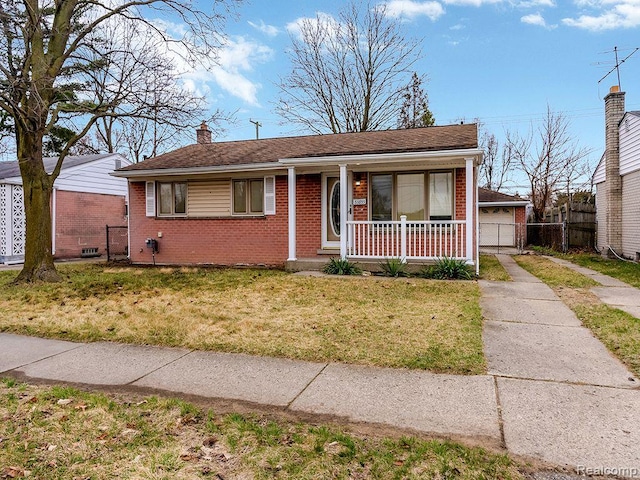 33855 Cherry Hill Rd, Westland, MI 48186 - view of front of house with brick siding, a porch, and a chimney