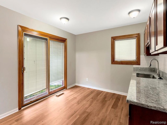 33855 Cherry Hill Rd, Westland, MI 48186 - unfurnished dining area featuring a sink and light wood-style flooring