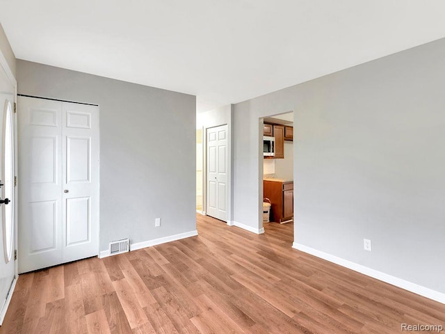 33855 Cherry Hill Rd, Westland, MI 48186 - unfurnished bedroom with light wood-type flooring and ensuite bathroom