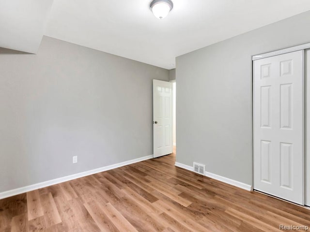 33855 Cherry Hill Rd, Westland, MI 48186 - unfurnished bedroom featuring wood finished floors and a closet