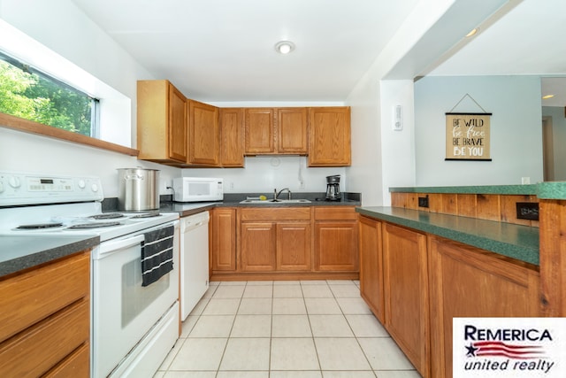 9420 Van Antwerp Rd, Brighton, MI 48116 - kitchen featuring white appliances, dark countertops, light tile patterned flooring, and brown cabinetry