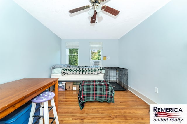 9420 Van Antwerp Rd, Brighton, MI 48116 - bedroom with wood finished floors and a ceiling fan