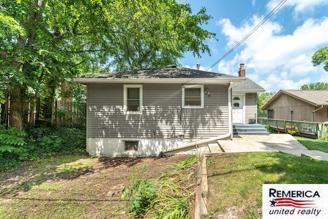 9420 Van Antwerp Rd, Brighton, MI 48116 - bungalow-style house featuring a patio area, a chimney, a wooden deck, and a front yard