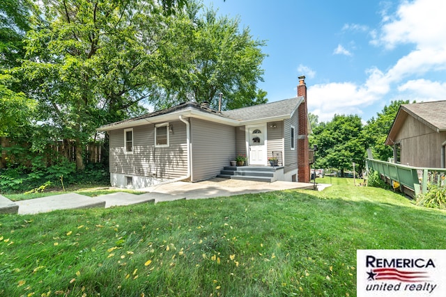 9420 Van Antwerp Rd, Brighton, MI 48116 - view of front facade with a chimney and a patio area