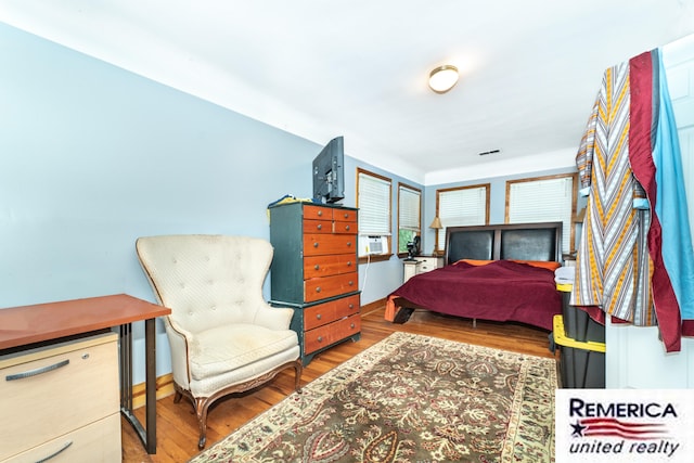 9420 Van Antwerp Rd, Brighton, MI 48116 - bedroom with wood finished floors and cooling unit