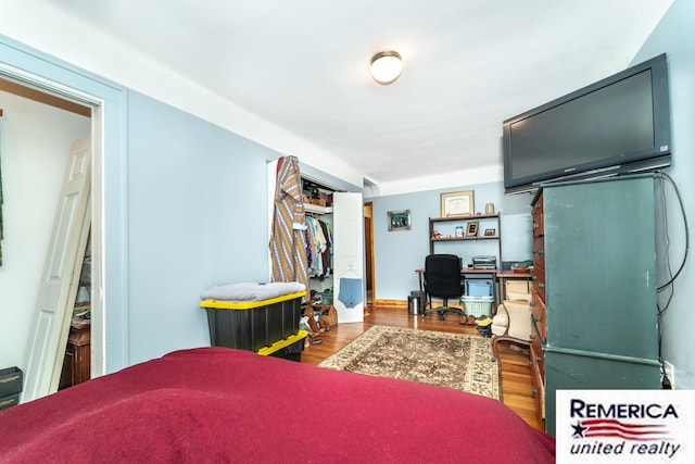 9420 Van Antwerp Rd, Brighton, MI 48116 - bedroom with a desk and wood finished floors