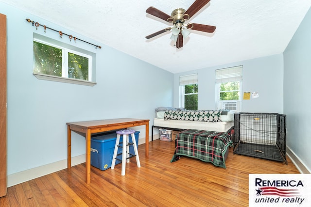 9420 Van Antwerp Rd, Brighton, MI 48116 - bedroom featuring wood finished floors, a textured ceiling, vaulted ceiling, and ceiling fan