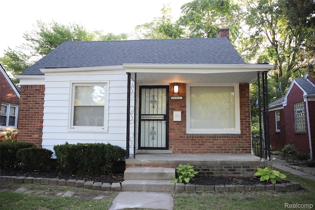 18951 Edinborough, Detroit, MI 48219 - bungalow-style house with a chimney, roof with shingles, and brick siding