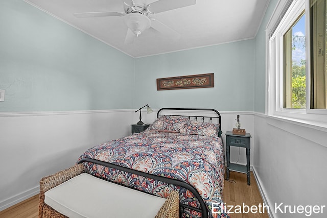 1215 Emerald Ave NE, Grand Rapids, MI 49505 - bedroom with wood finished floors, crown molding, and a ceiling fan