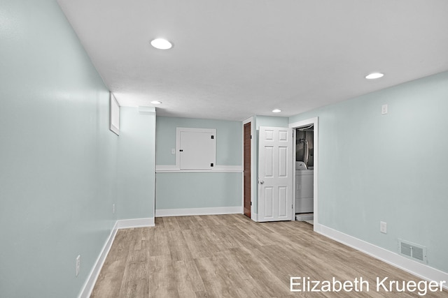 1215 Emerald Ave NE, Grand Rapids, MI 49505 - below grade area featuring washer / dryer, light wood-style flooring, and recessed lighting