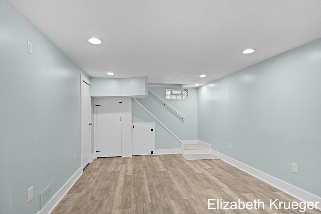 1215 Emerald Ave NE, Grand Rapids, MI 49505 - below grade area with recessed lighting, light wood-type flooring, and stairs