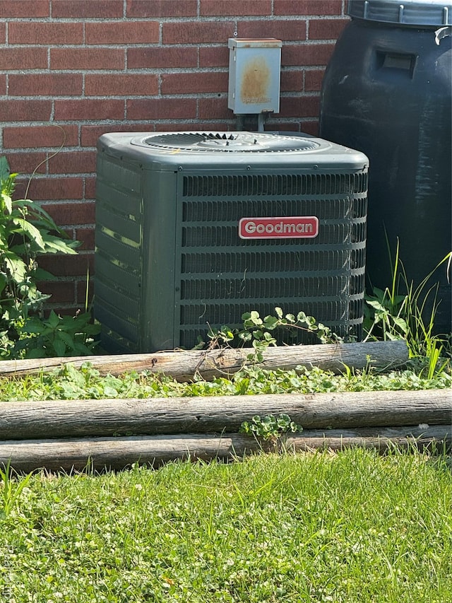 19612 Gaukler St, Saint Clair Shores, MI 48080 - exterior view of a central air condition unit and brick siding