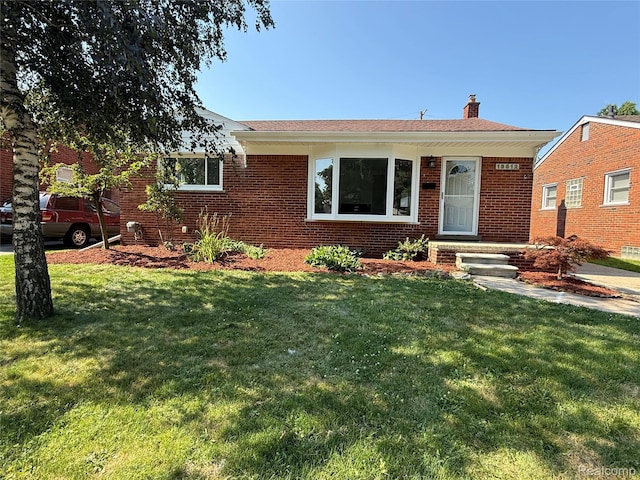 19612 Gaukler St, Saint Clair Shores, MI 48080 - single story home featuring brick siding, a chimney, and a front yard