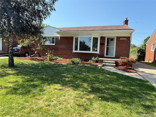 19612 Gaukler St, Saint Clair Shores, MI 48080 - ranch-style home featuring a chimney, brick siding, and a front lawn