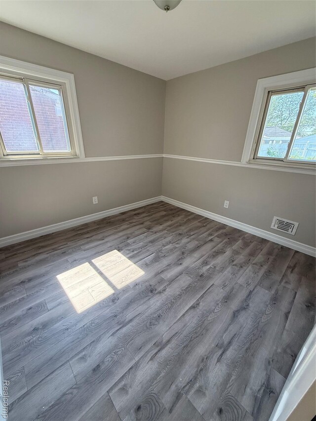 19612 Gaukler St, Saint Clair Shores, MI 48080 - spare room featuring wood finished floors and baseboards