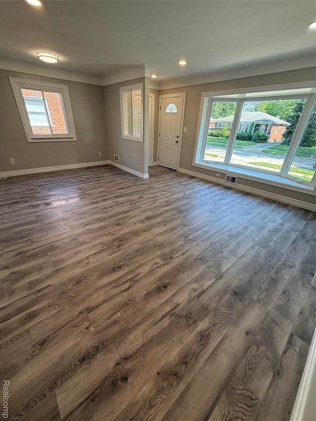 19612 Gaukler St, Saint Clair Shores, MI 48080 - unfurnished living room with healthy amount of natural light, dark wood finished floors, and recessed lighting